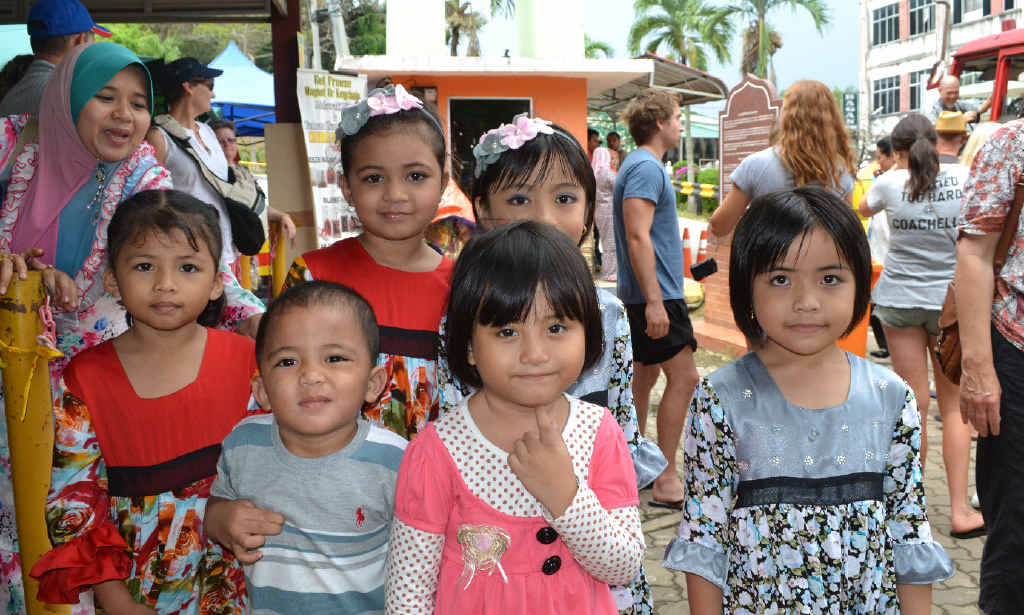 These Malaysian children had just been to a wedding which explains why they are so beautifully dressed. These Malaysian children had just been to a wedding which explains why they are so beautifully dressed.
